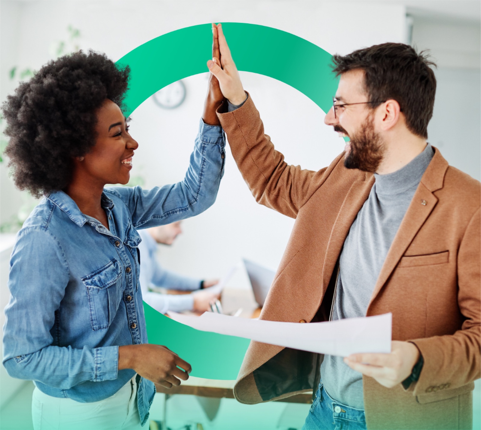 Two Clover teammates high-fiving in front of a green Clover ring backdrop.